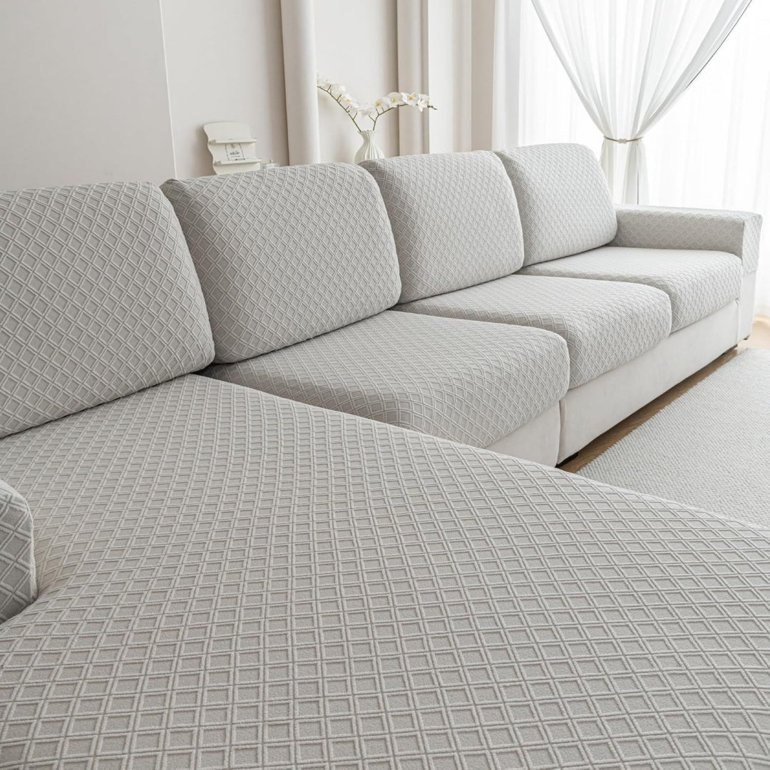 Divano confortevole grigio chiaro rivestimento in tessuto